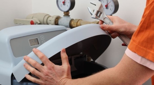 Man checking a water softener